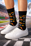 Black crew socks with colorful Formula racing car print, checkered flags, and helmet design