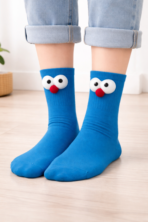 Blue crew socks with fluffy googly eye cartoon design for casual unisex wear