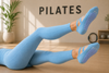Blue pilates grip socks with anti-slip heart grips and elastic ballet straps