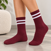 Burgundy crew socks with two white stripes around the upper cuff
