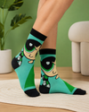 Green cartoon inspired crew socks featuring playful animated girl graphic artwork with retro style