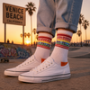 White retro California crew socks with rainbow text design and orange toe heel details