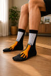Black novelty crew socks with funny realistic chicken leg design