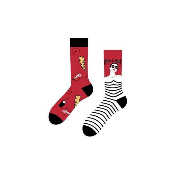  Chill Out Diva Socks – a mismatched pair that blends fierce and funky. One sock pops with red, black, and yellow icons like lightning bolts, lipstick, lips, and kisses. 