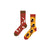 Coffee &amp; Sugar Mismatched Socks – the perfect blend of comfort and caffeine love. One sock features coffee beans, sugar cubes, and spoons on a rich red background,