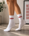White crew tennis socks featuring a red "Cool F*cker" script design.