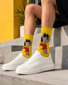 Yellow crew socks featuring a cool Snoopy cartoon character wearing sunglasses and a red shirt