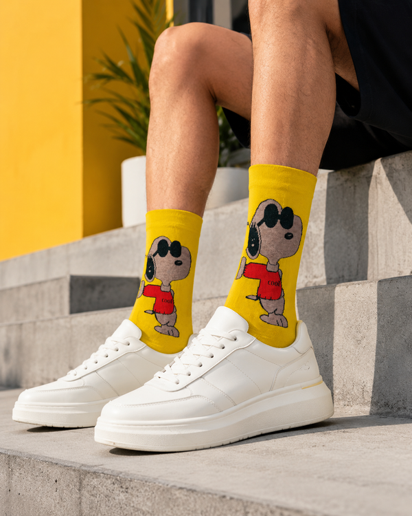 Yellow crew socks featuring a cool Snoopy cartoon character wearing sunglasses and a red shirt