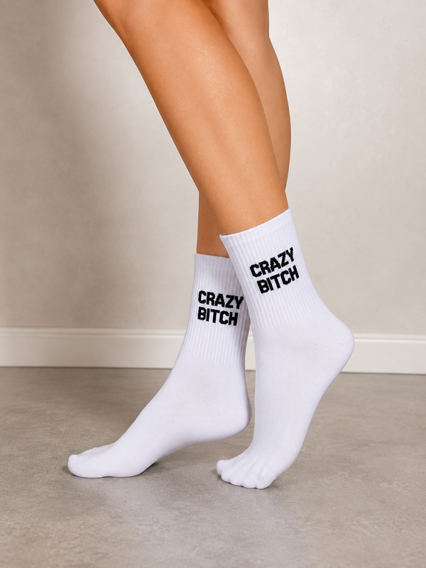 White crew socks featuring black Crazy Bitch statement text