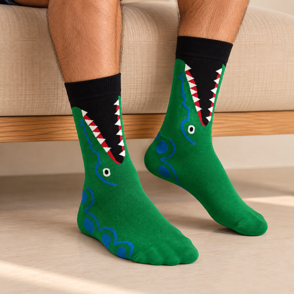 Green crew socks with open-mouth crocodile design, red and white teeth and blue details