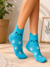 Turquoise ankle socks with 3D cat ears, a cute cat face, and white paw print pattern.