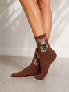 Brown crew socks featuring Fendi text and teddy bear wearing a black patterned scarf