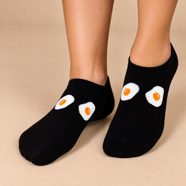 Black invisible socks with white and orange fried egg eye design