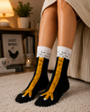 Black crew socks featuring realistic yellow chicken leg and chicken feet graphic design