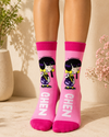 Cute Ghen cartoon girl character on bright pink crew socks with purple outfit and yellow bow.