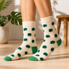 Cream crew socks with green broccoli pattern and contrasting green heels and toes