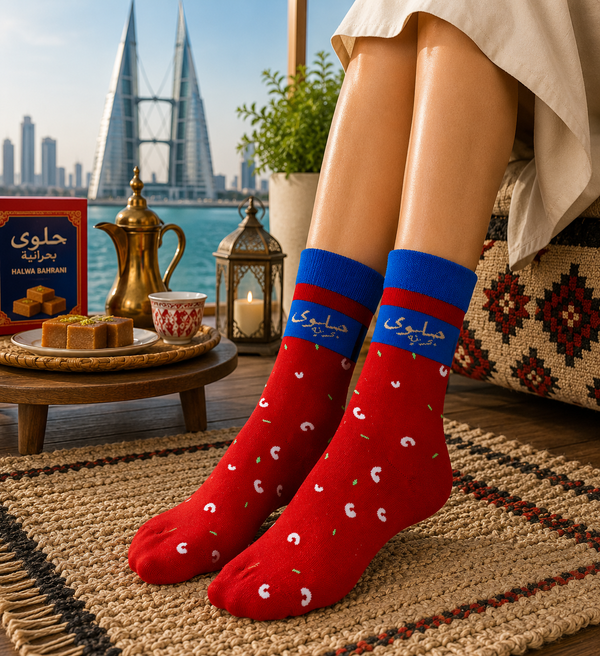 Red and blue Halwa Bahrani Socks with Arabic text and traditional sweet-inspired pattern