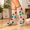 Beige Happy Planet crew socks with colorful planets, Earth graphics and stars