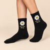 Black crew socks with smiling daisy and Have a Nice Daisy design