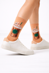 Main image: Crew socks with iced coffee cup graphic and whipped topping designModel image: Legs wearing iced coffee cup crew socks with white sneakersClose-up image: Close-up of iced coffee cup graphic on crew socks