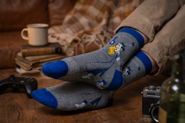 Inspector Gadget Crew Socks featuring the famous cartoon detective on a grey and blue sock design.