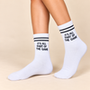 White crew socks with black stripes and It’s All Part of the Game slogan