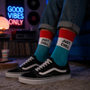 Turquoise, white, and red crew socks featuring a bold “JUST CHILL” text design with a clean retro-inspired color block style.