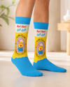 Pair of blue Kari Kari Chicken Snack Crew Socks featuring the classic yellow chick snack packaging design on a white background.