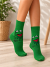 Green crew socks featuring Kermit the Frog smiling with his hands folded on a matching green background.