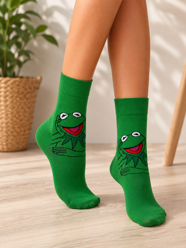Green crew socks featuring Kermit the Frog smiling with his hands folded on a matching green background.