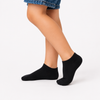 Pair of black low-cut ankle socks for kids aged 5–6 years on a white background.
