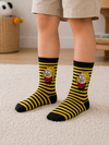 Kids yellow and black striped crew socks with a cartoon-inspired character for ages 7–9 years.
