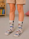 Kids cream crew socks with colorful crocodile illustrations for children aged 4–6 years.