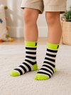Kids crew socks with black and white stripes, neon green cuffs, heels, and toes, designed for children aged 3–5 years.