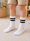 White kids crew socks with black double stripes for children aged 7–9years.