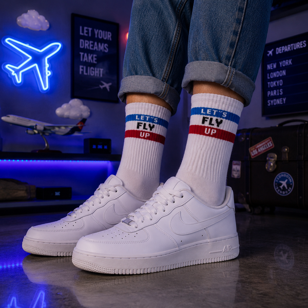 White ribbed crew socks with blue and red stripe details featuring the text “LET’S FLY UP” in a clean sporty retro style.