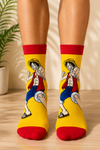 Luffy One Piece anime crew socks featuring Monkey D. Luffy on a bright yellow background.