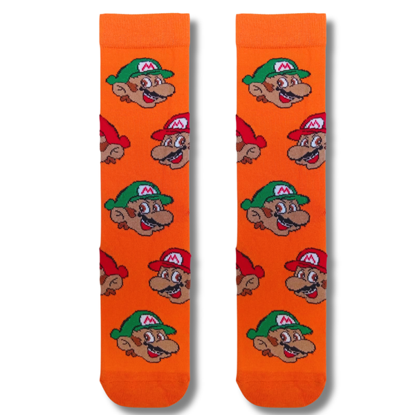 Pair of bright orange Mario & Luigi Crew Socks featuring an all-over pattern of Mario and Luigi character faces on a white background.