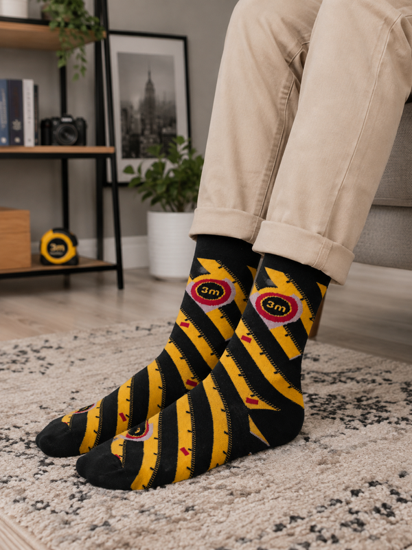 Black crew socks with yellow measuring tape pattern and red details