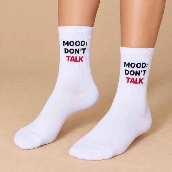 White crew socks with Mood Don’t Talk text in black and red