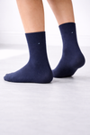 Pair of navy blue plain crew socks with minimal stitch detail on a clean white background