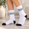 White crew socks with black Need Weed graphic and contrasting black toe and heel