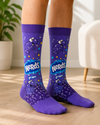 Pair of purple Nerds Grape Candy Crew Socks featuring classic Nerds characters and grape candy artwork on a white background.