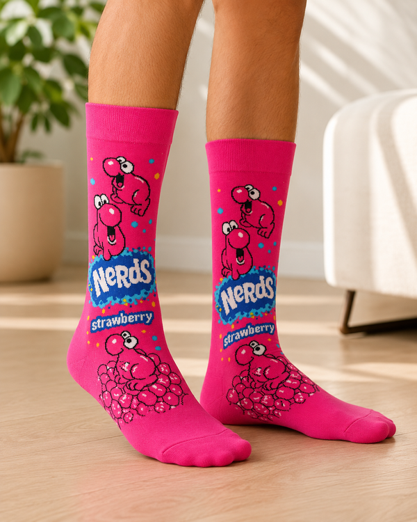 Pair of bright pink Nerds Strawberry Candy Crew Socks featuring classic Nerds characters and strawberry candy artwork on a white background.