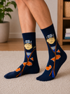Dark blue anime socks featuring a ninja character with orange cloud pattern and headband design.