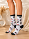 Nutella Patterned White Crew Socks with all-over Nutella jar print and black cuff, heel, and toe details.