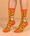 Orange Duck Crowd crew socks featuring an all-over pattern of yellow-orange ducks with red beaks, one light blue duck, and matching orange cuffs, heels and toes.