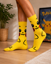Bright yellow Pikachu crew socks with cute cartoon face design