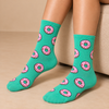Mint green crew socks with pink frosted donut pattern