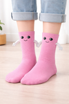 Pink Magnetic Hug crew socks with smiling cartoon face and playful hugging arm design
